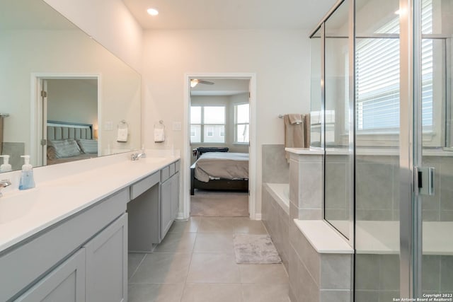 4951 Ranahan Pass, Saint Hedwig, TX 78152 - ensuite bathroom featuring double vanity, tile patterned floors, a shower stall, ceiling fan, and recessed lighting