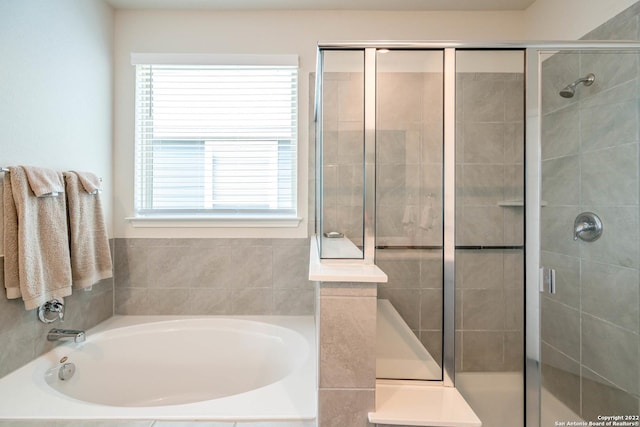 4951 Ranahan Pass, Saint Hedwig, TX 78152 - bathroom featuring plenty of natural light, a garden tub, and a shower stall
