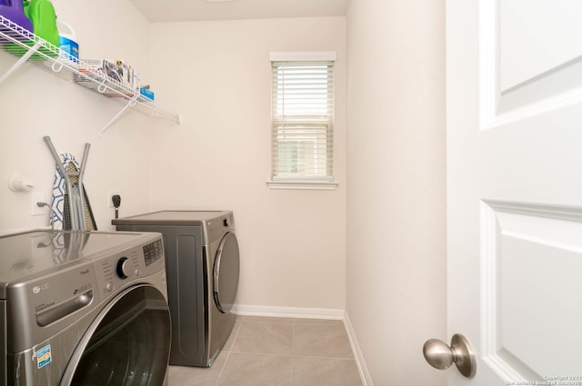4951 Ranahan Pass, Saint Hedwig, TX 78152 - laundry area with separate washer and dryer and light tile patterned floors
