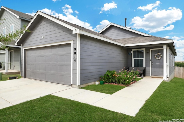 9015 Lunar Cv, San Antonio, TX 78252 - ranch-style house with an attached garage, driveway, and a front lawn