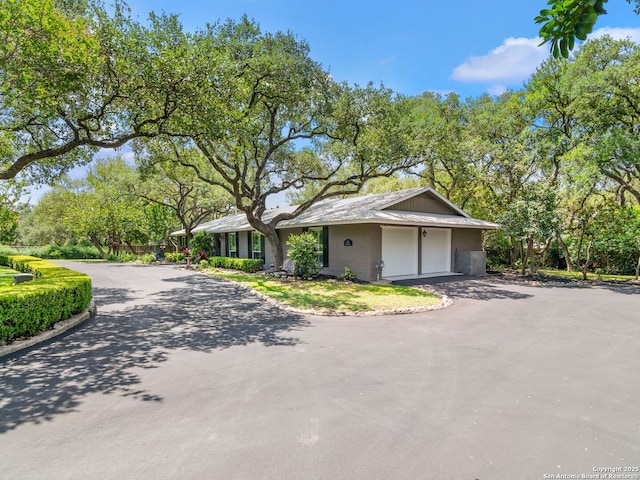 132 Wagon Trail Rd, Shavano Park, TX 78231 - view of front facade with asphalt driveway and an attached garage
