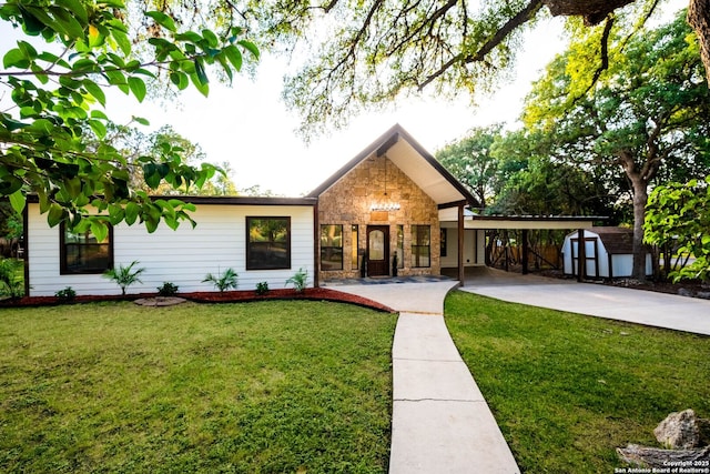 28121 Timberline, San Antonio, TX 78260 - view of front facade featuring a storage unit, stone siding, a front yard, and concrete driveway