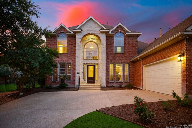 20907 Cactus Peak, San Antonio, TX 78258 - traditional-style house with driveway, brick siding, and an attached garage