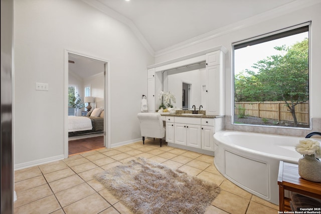 20907 Cactus Peak, San Antonio, TX 78258 - ensuite bathroom featuring lofted ceiling, tile patterned flooring, vanity, a bath, and ornamental molding