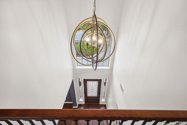20907 Cactus Peak, San Antonio, TX 78258 - foyer featuring a chandelier, a high ceiling, and wood finished floors