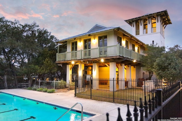 20907 Cactus Peak, San Antonio, TX 78258 - back of property featuring stucco siding, a community pool, a patio area, and a balcony