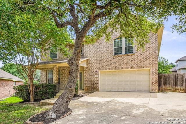 223 Verde Blf, San Antonio, TX 78258 - traditional-style house featuring brick siding, concrete driveway, and an attached garage