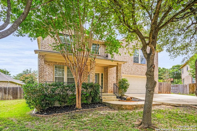 223 Verde Blf, San Antonio, TX 78258 - traditional-style home with an attached garage, concrete driveway, and brick siding