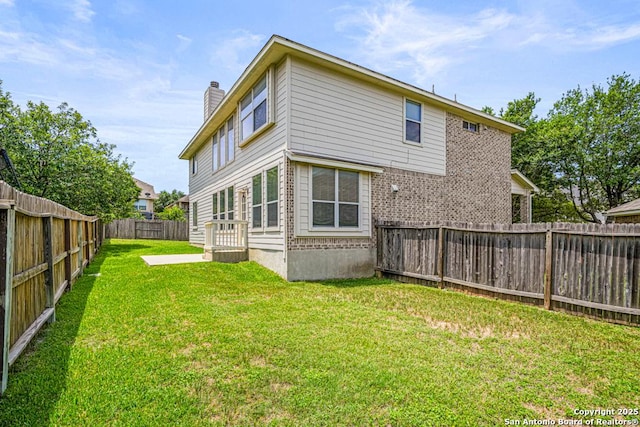 223 Verde Blf, San Antonio, TX 78258 - back of house with a chimney and a fenced backyard