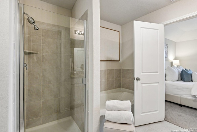 183 Amethyst Woodstar, San Antonio, TX 78253 - full bath featuring ensuite bathroom, a bath, a stall shower, and tile patterned floors