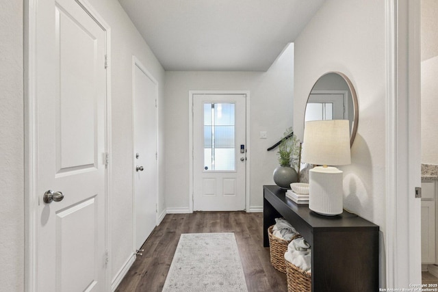 183 Amethyst Woodstar, San Antonio, TX 78253 - doorway to outside featuring dark wood finished floors and baseboards