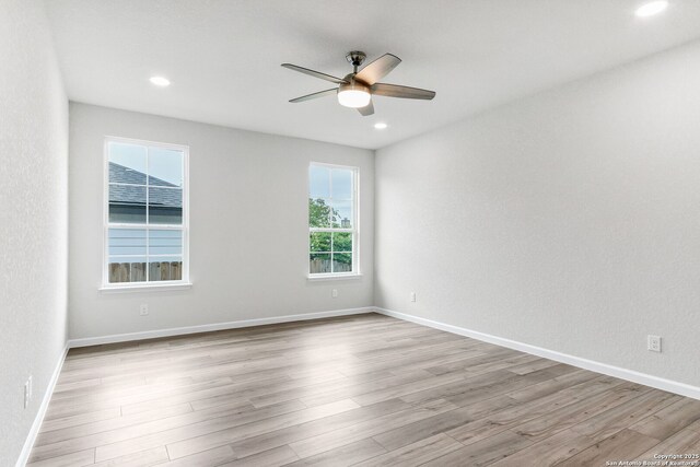 9911 Loma Alta Cir, Converse, TX 78109 - unfurnished room with ceiling fan, wood finished floors, and recessed lighting