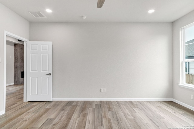 9911 Loma Alta Cir, Converse, TX 78109 - empty room featuring light wood-type flooring, ceiling fan, and recessed lighting