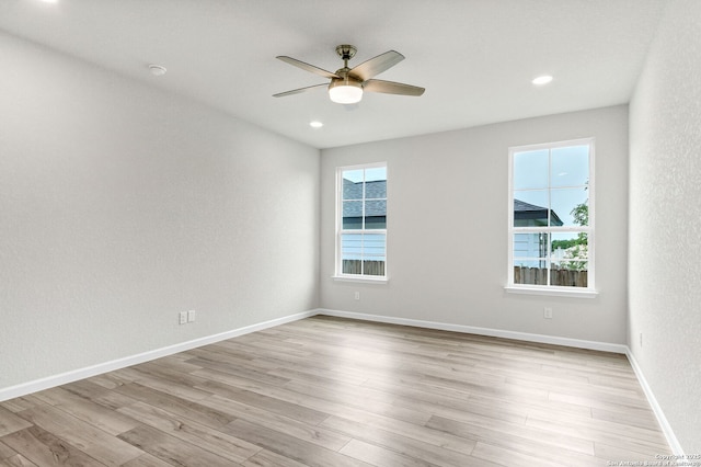 9911 Loma Alta Cir, Converse, TX 78109 - unfurnished room with a ceiling fan, light wood finished floors, and recessed lighting
