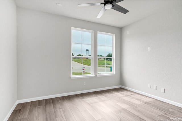 9911 Loma Alta Cir, Converse, TX 78109 - spare room with a ceiling fan and light wood finished floors