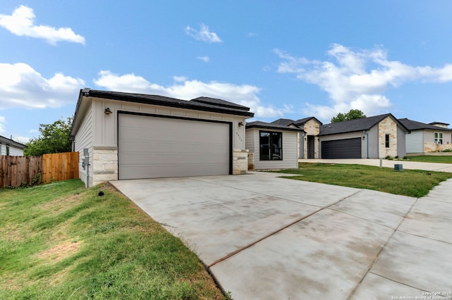 9911 Loma Alta Cir, Converse, TX 78109 - view of front of house featuring stone siding, a garage, and driveway