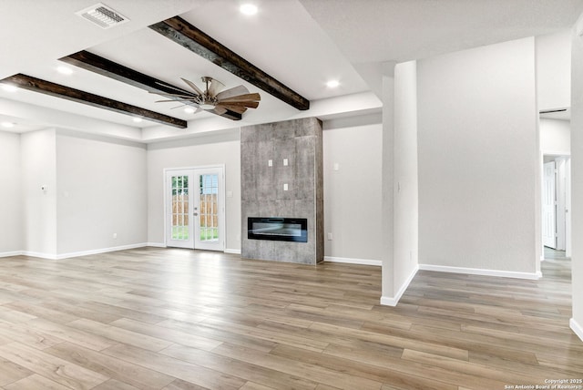 9911 Loma Alta Cir, Converse, TX 78109 - unfurnished living room featuring a ceiling fan, recessed lighting, beamed ceiling, light wood-style flooring, and a fireplace