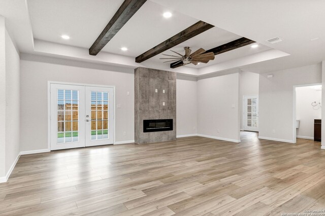 9911 Loma Alta Cir, Converse, TX 78109 - unfurnished living room with beam ceiling, light wood-style floors, a ceiling fan, a fireplace, and recessed lighting