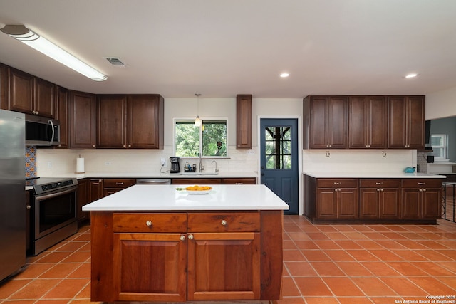 10567 Rocking M, Helotes, TX 78023 - kitchen featuring stainless steel appliances, decorative backsplash, light tile patterned flooring, light countertops, and recessed lighting