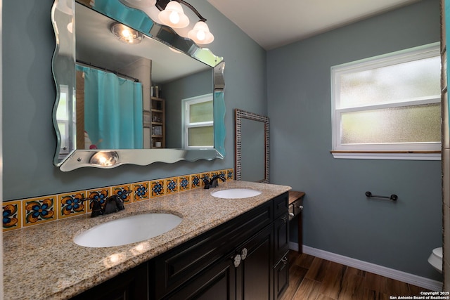 10567 Rocking M, Helotes, TX 78023 - bathroom featuring wood finished floors, double vanity, and a shower with shower curtain
