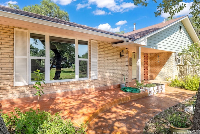 10567 Rocking M, Helotes, TX 78023 - entrance to property with brick siding and roof with shingles