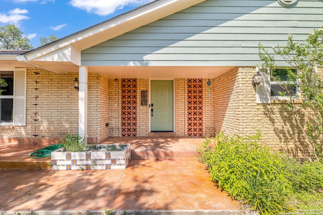 10567 Rocking M, Helotes, TX 78023 - doorway to property featuring brick siding