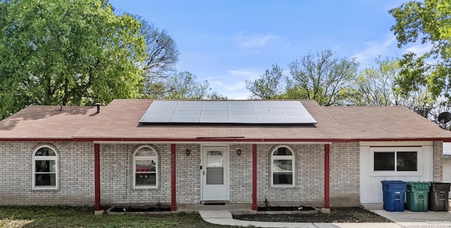 4530 El Simpatico, San Antonio, TX 78233 - ranch-style house featuring roof mounted solar panels, roof with shingles, and brick siding