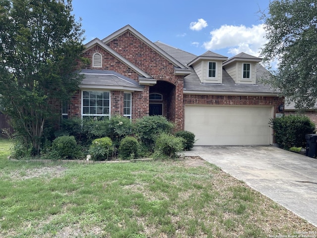 229 Gardner, Cibolo, TX 78108 - traditional-style home with concrete driveway, brick siding, and an attached garage