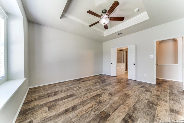 26215 Presidio Blf, Boerne, TX 78015 - unfurnished room with a tray ceiling, a ceiling fan, plenty of natural light, wood finished floors, and crown molding