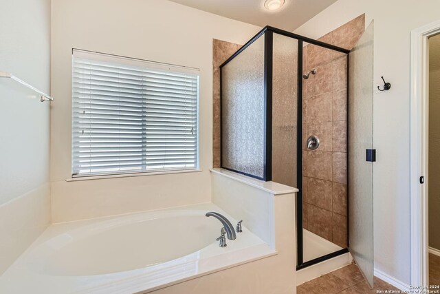 26215 Presidio Blf, Boerne, TX 78015 - bathroom with a stall shower, a bath, and tile patterned floors