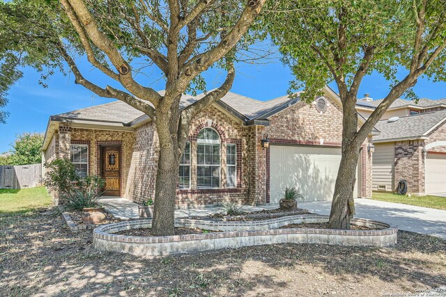 26215 Presidio Blf, Boerne, TX 78015 - view of front of house with brick siding, an attached garage, and concrete driveway