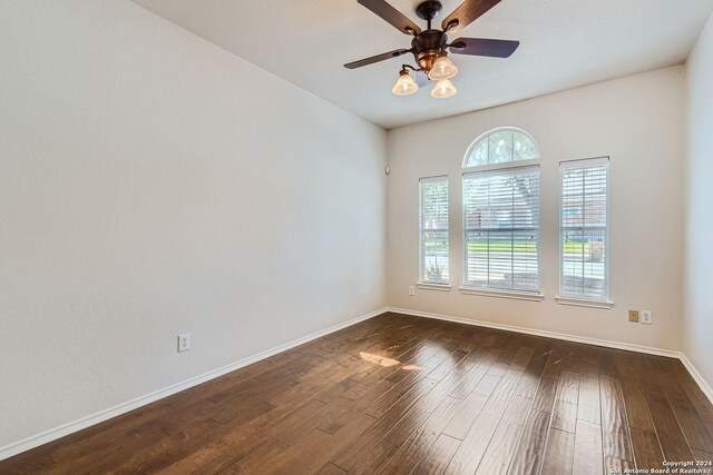 26215 Presidio Blf, Boerne, TX 78015 - empty room with ceiling fan and dark wood-type flooring