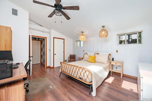 227 Devonshire, San Antonio, TX 78209 - bedroom featuring a desk, wood finished floors, lofted ceiling, a wall mounted air conditioner, and a ceiling fan