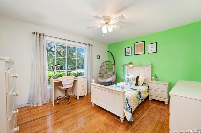 227 Devonshire, San Antonio, TX 78209 - bedroom with light wood-style flooring, a ceiling fan, and a desk