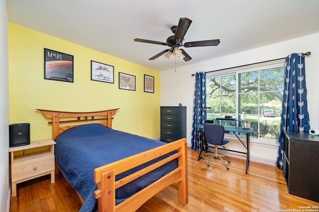 227 Devonshire, San Antonio, TX 78209 - bedroom with light wood-style flooring, an office area, and a ceiling fan
