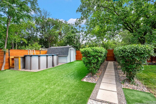 227 Devonshire, San Antonio, TX 78209 - fenced backyard with an outdoor pool, a shed, and view of scattered trees