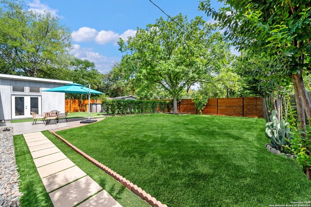 227 Devonshire, San Antonio, TX 78209 - fenced backyard featuring french doors and a patio