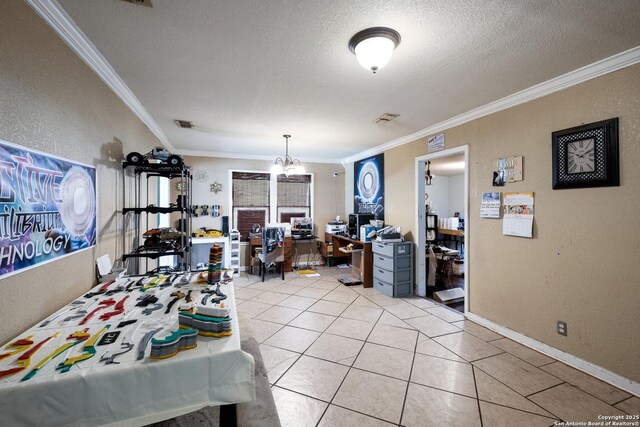 503 E Palfrey, San Antonio, TX 78223 - dining room with a desk, ornamental molding, a textured ceiling, light tile patterned floors, and a chandelier