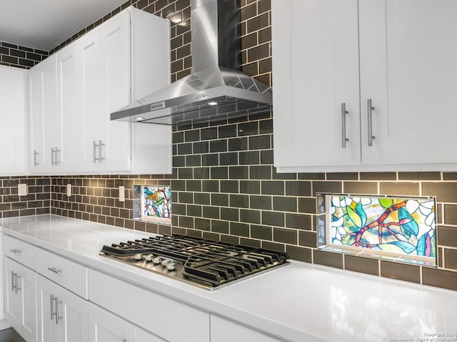 338 E Olmos, San Antonio, TX 78212 - kitchen featuring wall chimney range hood, stainless steel gas cooktop, white cabinetry, and light countertops