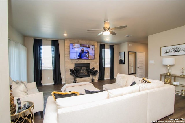 12904 Liam Ct, Saint Hedwig, TX 78152 - living room featuring a tile fireplace, dark wood-style floors, and ceiling fan