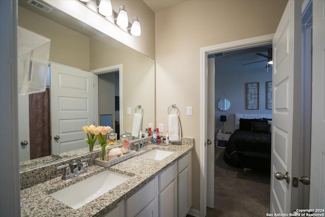 12904 Liam Ct, Saint Hedwig, TX 78152 - ensuite bathroom featuring double vanity and baseboards