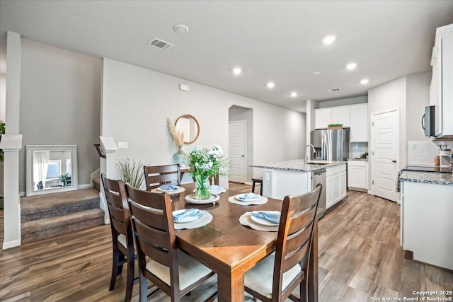 3016 Muscat, Schertz, TX 78154 - dining area featuring light wood-style flooring, recessed lighting, and stairs