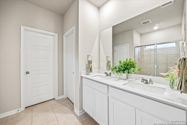 3016 Muscat, Schertz, TX 78154 - bathroom featuring double vanity, a stall shower, and tile patterned floors