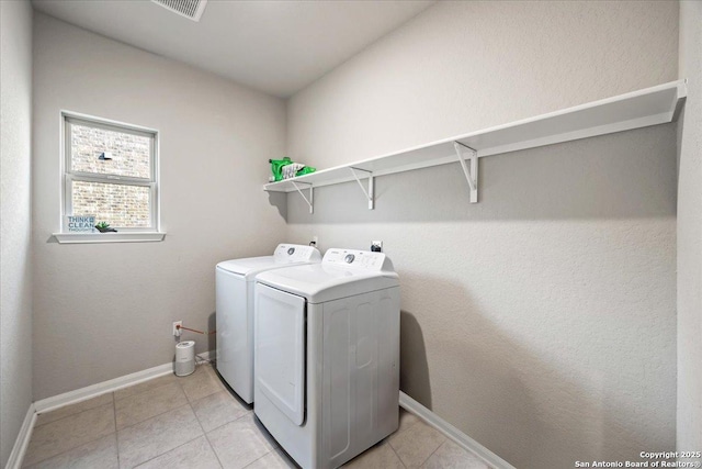 3016 Muscat, Schertz, TX 78154 - laundry area featuring washing machine and dryer and light tile patterned floors