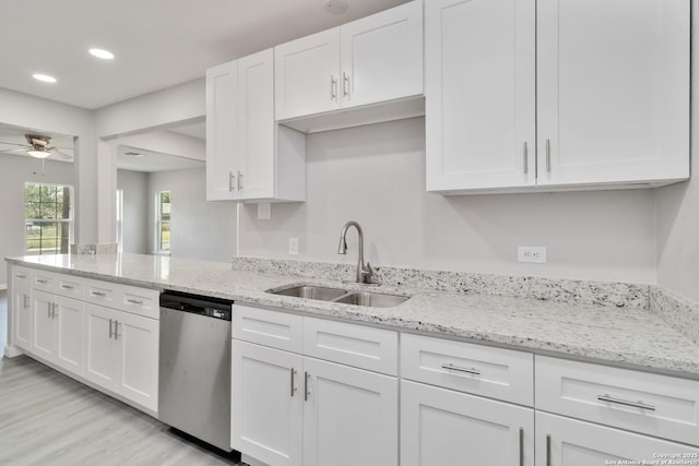 2738 Ravina, San Antonio, TX 78222 - kitchen with stainless steel dishwasher, white cabinets, light wood-style floors, a ceiling fan, and recessed lighting