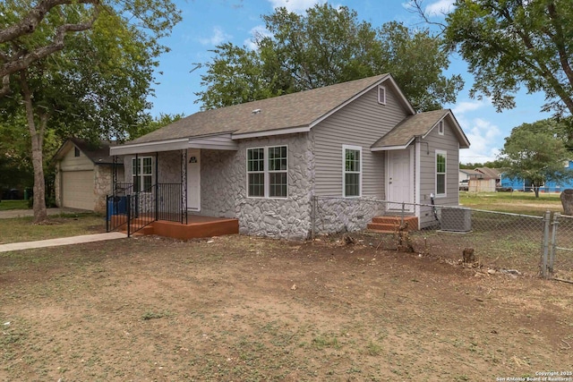 2738 Ravina, San Antonio, TX 78222 - view of front facade with roof with shingles and stone siding