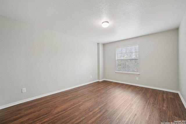 12107 Dawson Cir, San Antonio, TX 78253 - unfurnished room with dark wood-style flooring and a textured ceiling