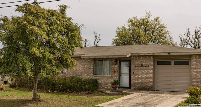 123 Turkey Dr, Harper, TX 78631 - view of front of house featuring brick siding, a garage, concrete driveway, and a shingled roof