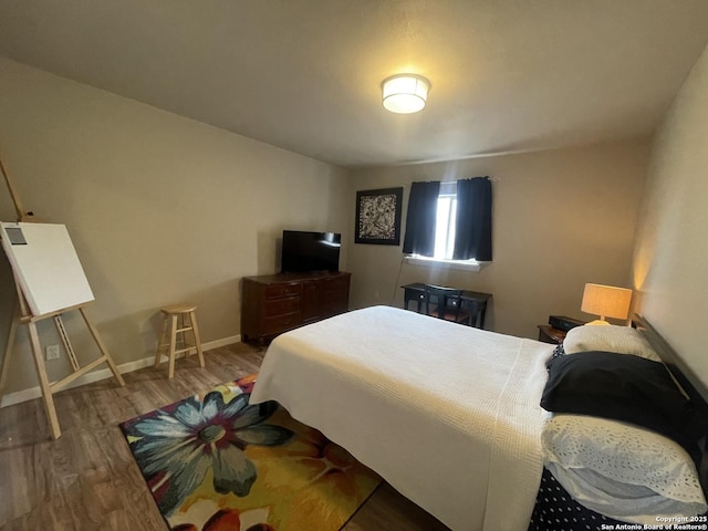 123 Turkey Dr, Harper, TX 78631 - bedroom with wood finished floors and baseboards