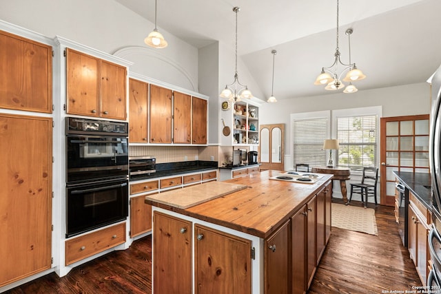 2 Fm 289, Comfort, TX 78013 - kitchen featuring a chandelier, dark wood-style floors, butcher block counters, decorative backsplash, and a center island
